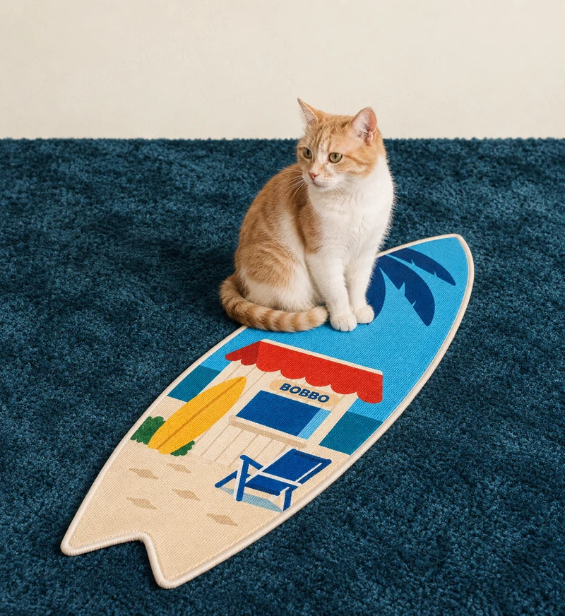 A cat enjoying a BOBBO surfboard scratcher at home